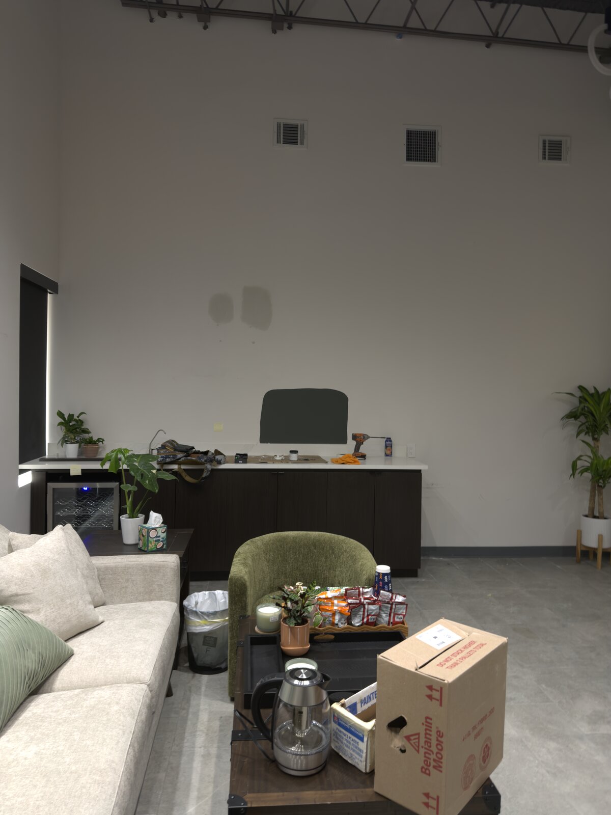 Commercial buildout mid-painting with test swatches, Houston